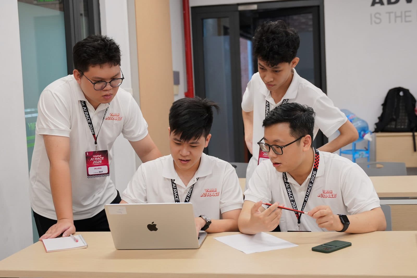 The team heads-down on laptops at Viettel AI Race 2026